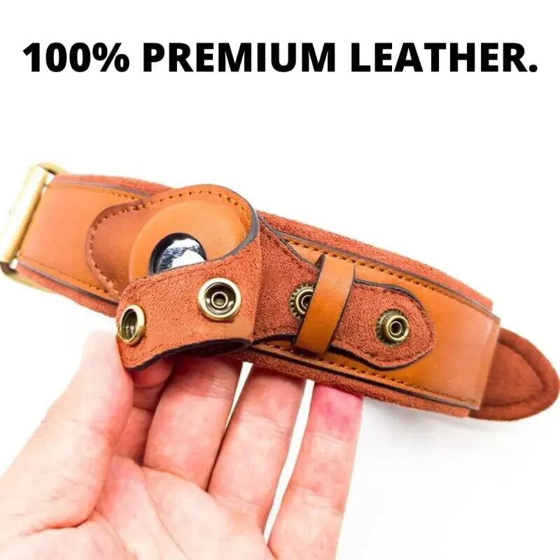Brown leather knife sheath held in a hand with '100% Premium Leather' text above.